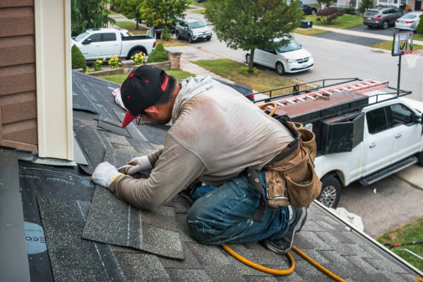 Professional Roof Replacement technician working in Whitestone, NY